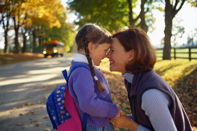 Mother and Daughter Waiting for School Bus